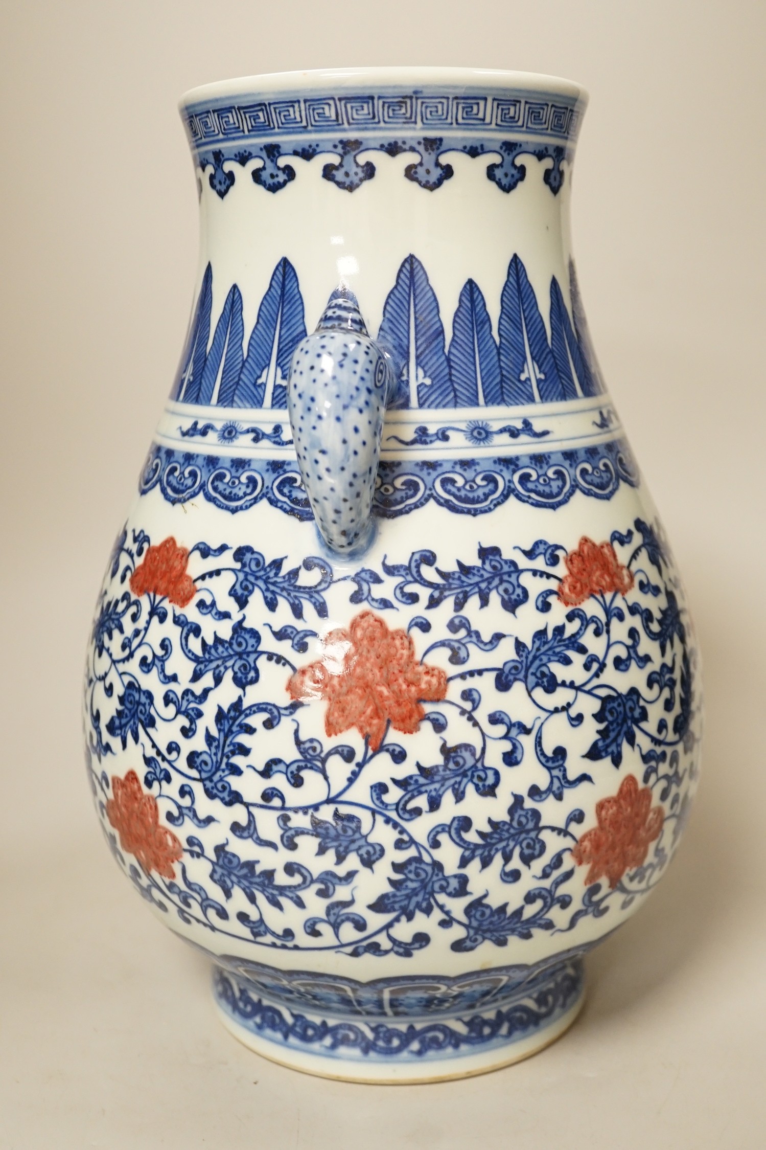 A Chinese underglaze blue and copper red two-handled vase. 31cm tall